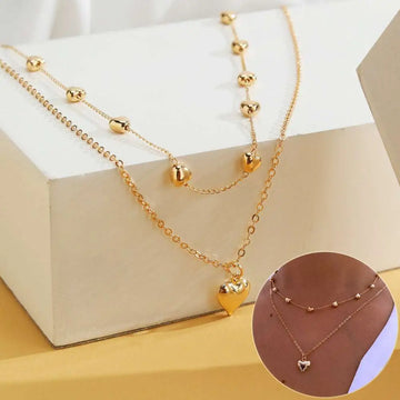 Gold-toned double layer heart pendant fine chain necklace with delicate links and spherical bead accents
