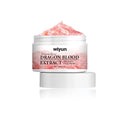 A white jar of dragon blood extract anti-aging face cream showing pink textured gel inside for skin rejuvenation