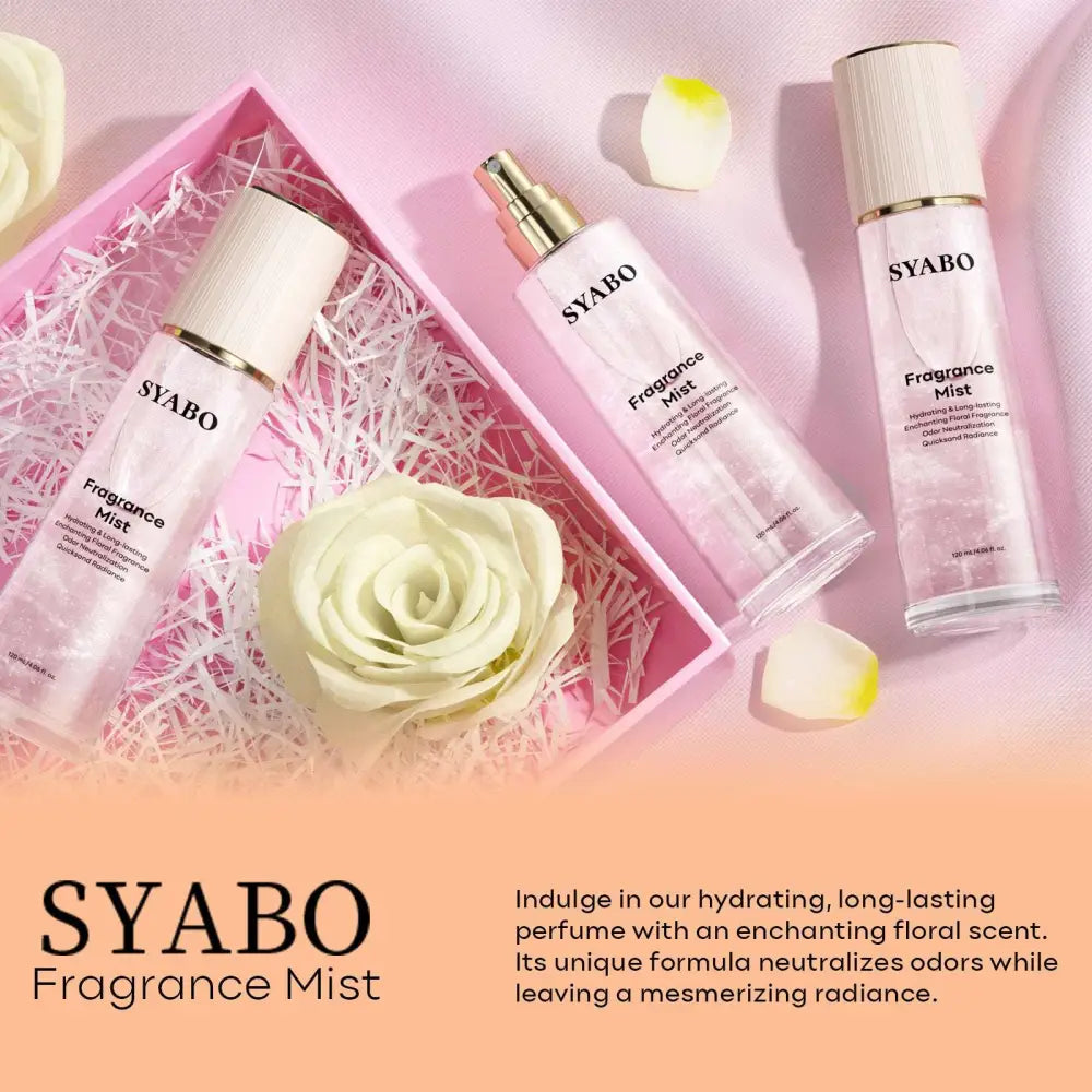 Three transparent glass bottles of dream quicksand body spray syabo fragrance mist with white caps and gold nozzles