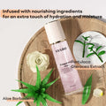 Translucent pink dream quicksand body spray syabo fragrance mist bottle with white ribbed cap and botanical label design