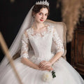 Dream slim sleeve lace ivory wedding gown in large size featuring three-quarter sleeves and a flowing tulle skirt