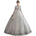Elegant dream slim sleeve lace ivory wedding gown with three-quarter sleeves and large size voluminous tulle skirt