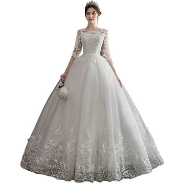 Elegant dream slim sleeve lace ivory wedding gown with three-quarter sleeves and large size voluminous tulle skirt