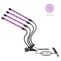Set of four black flexible dual arm clip led grow lights with purple and pink tubes connected to a remote control unit