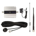 Silver aluminum dual band mobile phone amplifier with black display panel and spiral and straight antennas ±3dbm total