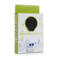 Black circular bluetooth car hands free kit in lime green and white dual usb car phone music player packaging