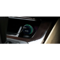 A sleek dual usb car hands free phone music player with a black body and vibrant green circular rim