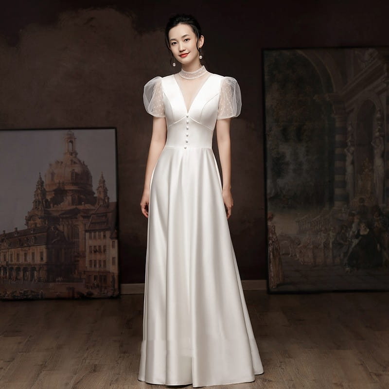 Elegant white engagement wedding dress in ivory satin with a v-neckline and sheer puff sleeves