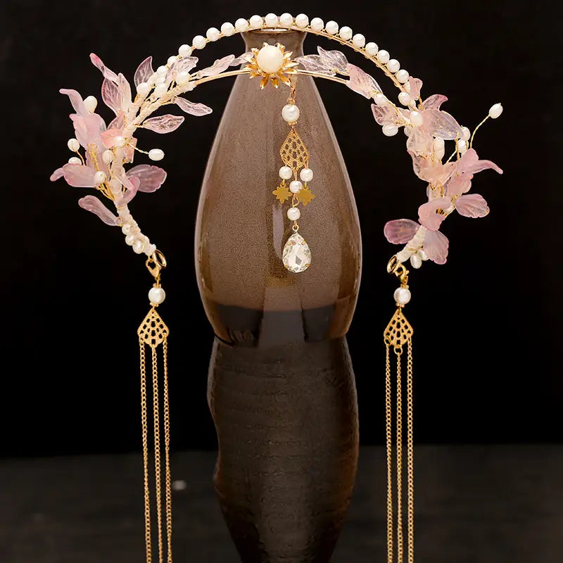 Elegant gold-toned floral hanfu tassels girls fashion headband adorned with pink translucent petals white pearls and dangling crystal teardrop pendants for girls fashion.