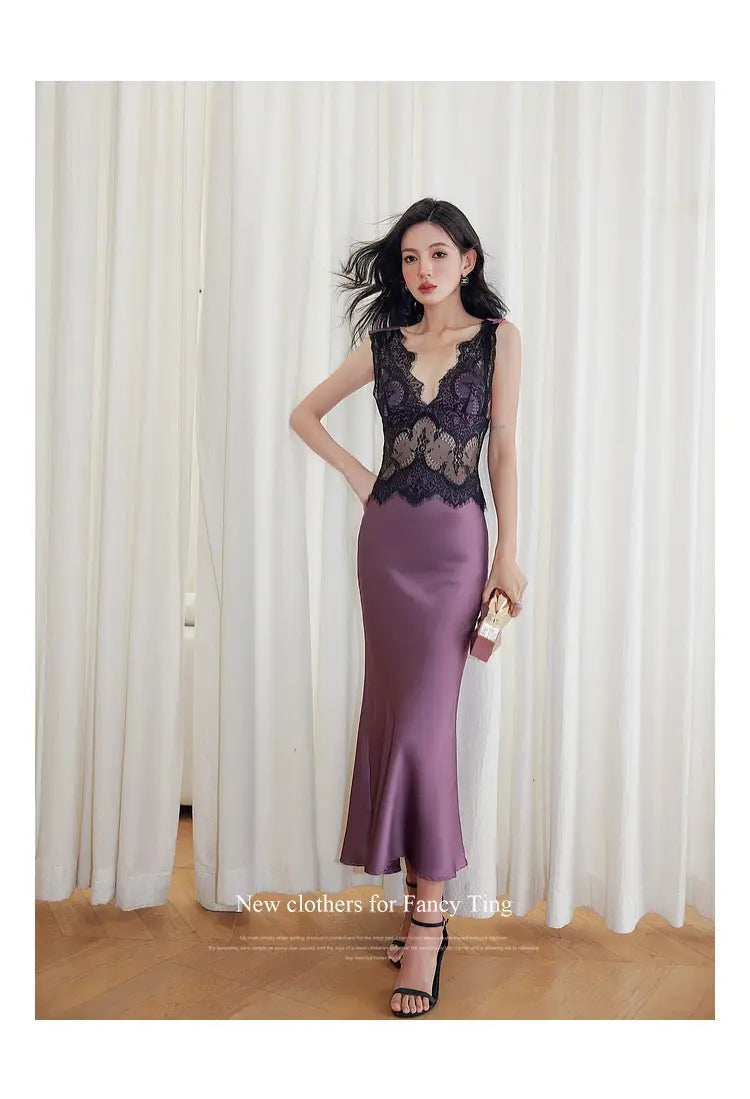 A sleeveless lace sheath dress in satin-like purple fabric with intricate black lace detailing across the bodice.