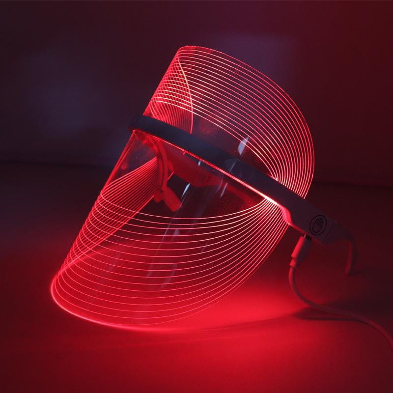 Multifunctional facial massager led beauty mask with red led light therapy, featuring a sleek curved design and transparent visor for facial beauty and lifting tool massagers.