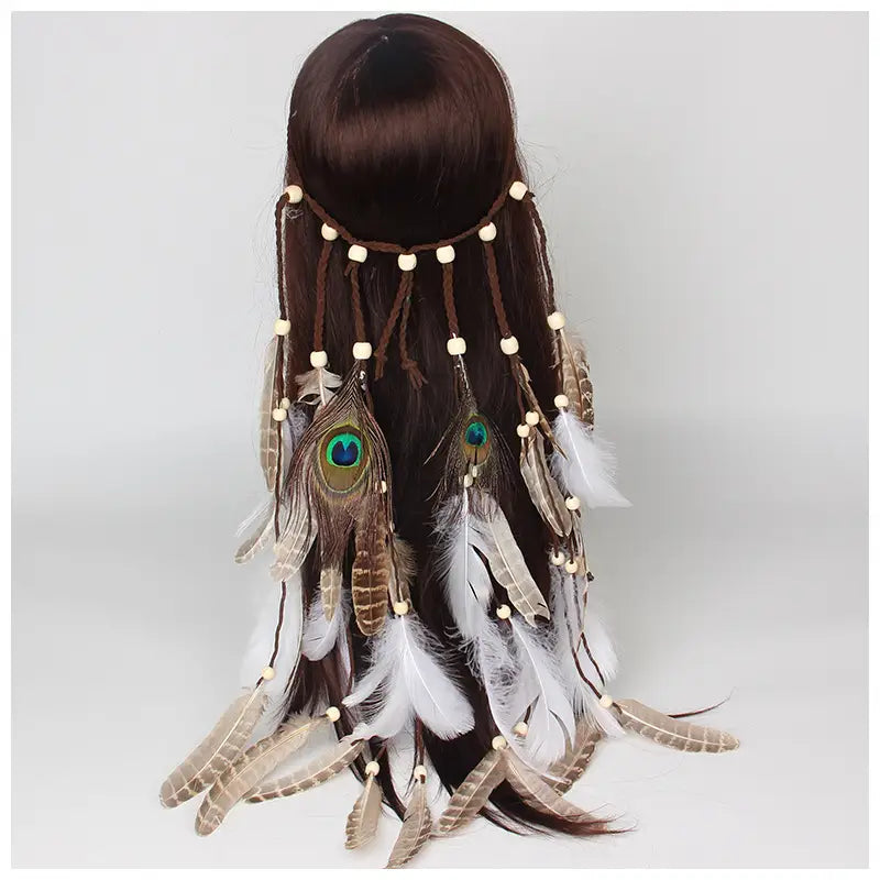 White feather hairband feather hair accessories featuring a cream-colored bead band and cascading peacock feathers with iridescent green eyes accented by white and brown feathers.