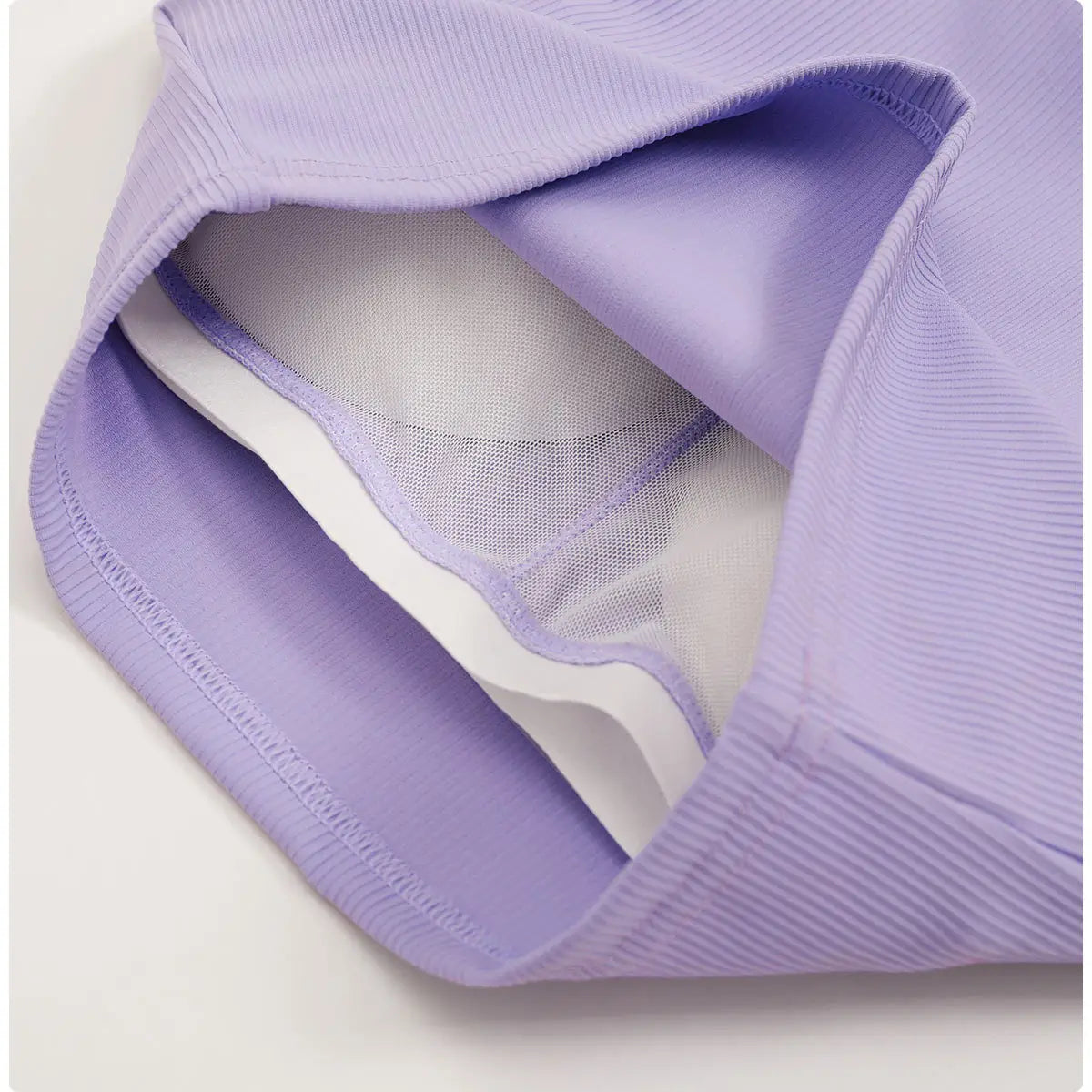 lavender ribbed running sports bra with quick dry breathable fabric and white mesh lining for enhanced comfort.