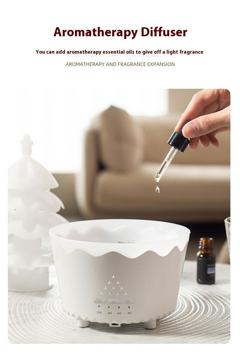 White ceramic Christmas tree essential oil aroma diffuser humidifier with scalloped rim and triangular cutout pattern showcasing design essential oil features.