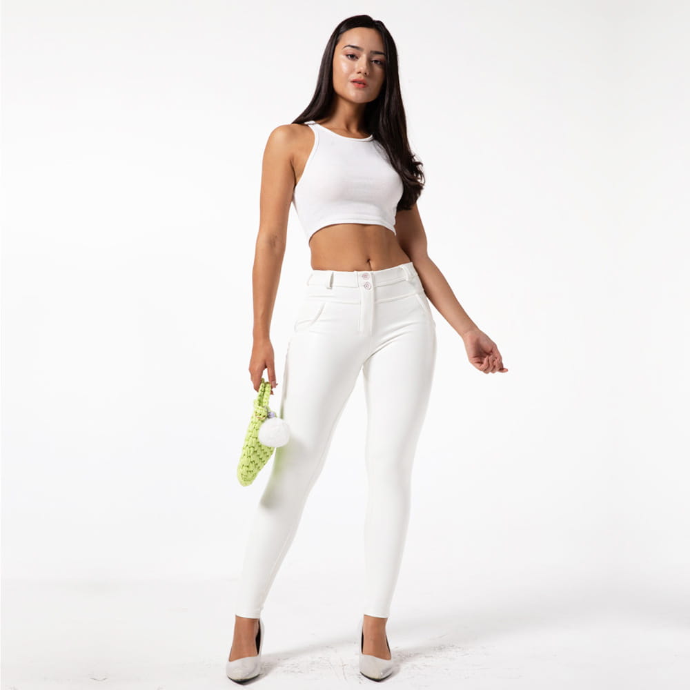 white pu leather high waisted skinny pants by royale essence lux showcasing sleek white leather fitness pants design.