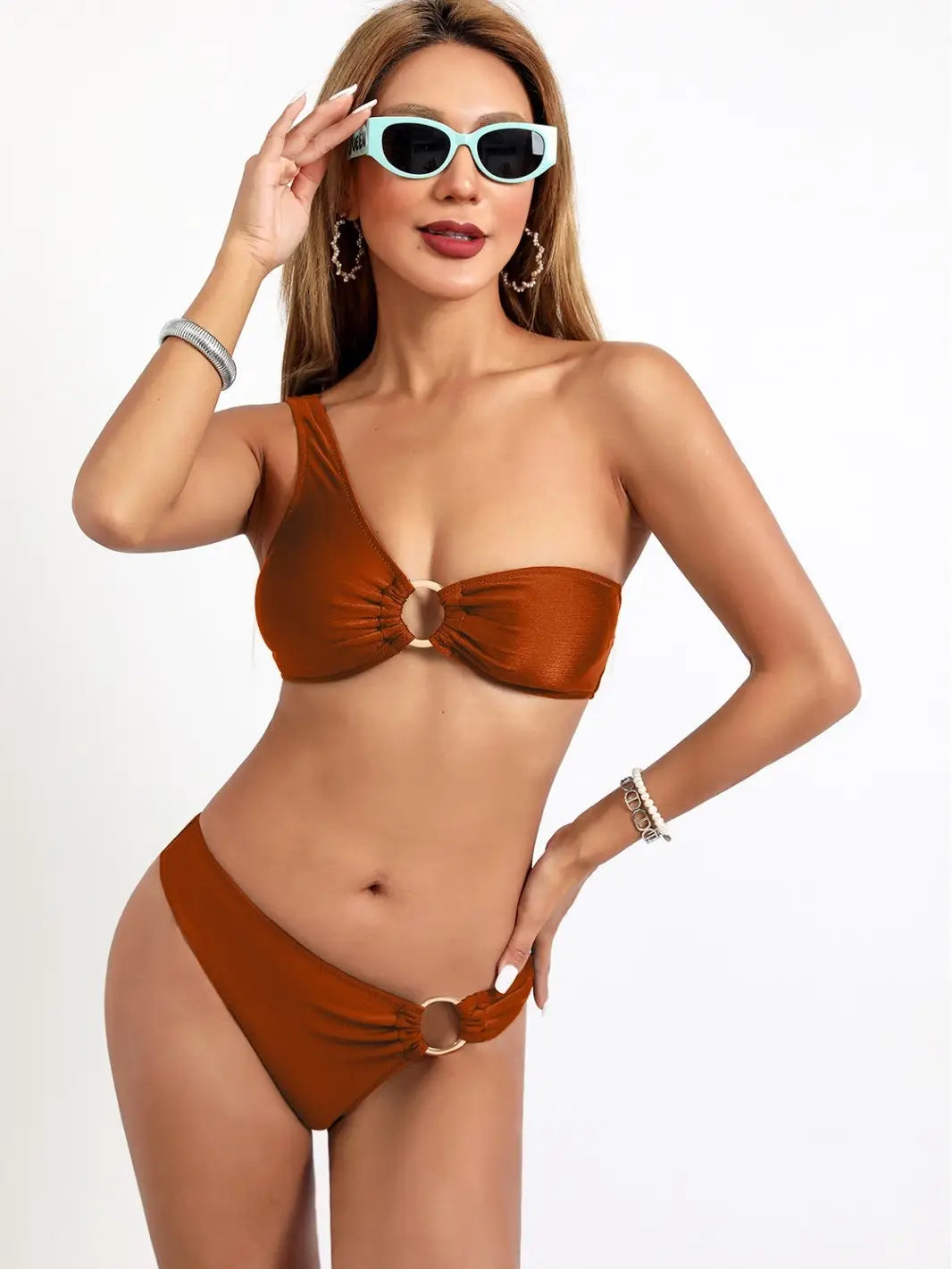 a stylish rust-colored one-piece bikini nylon starlight set with a bow detail at the front and matching gold ring accents, designed as a split sexy bikini.