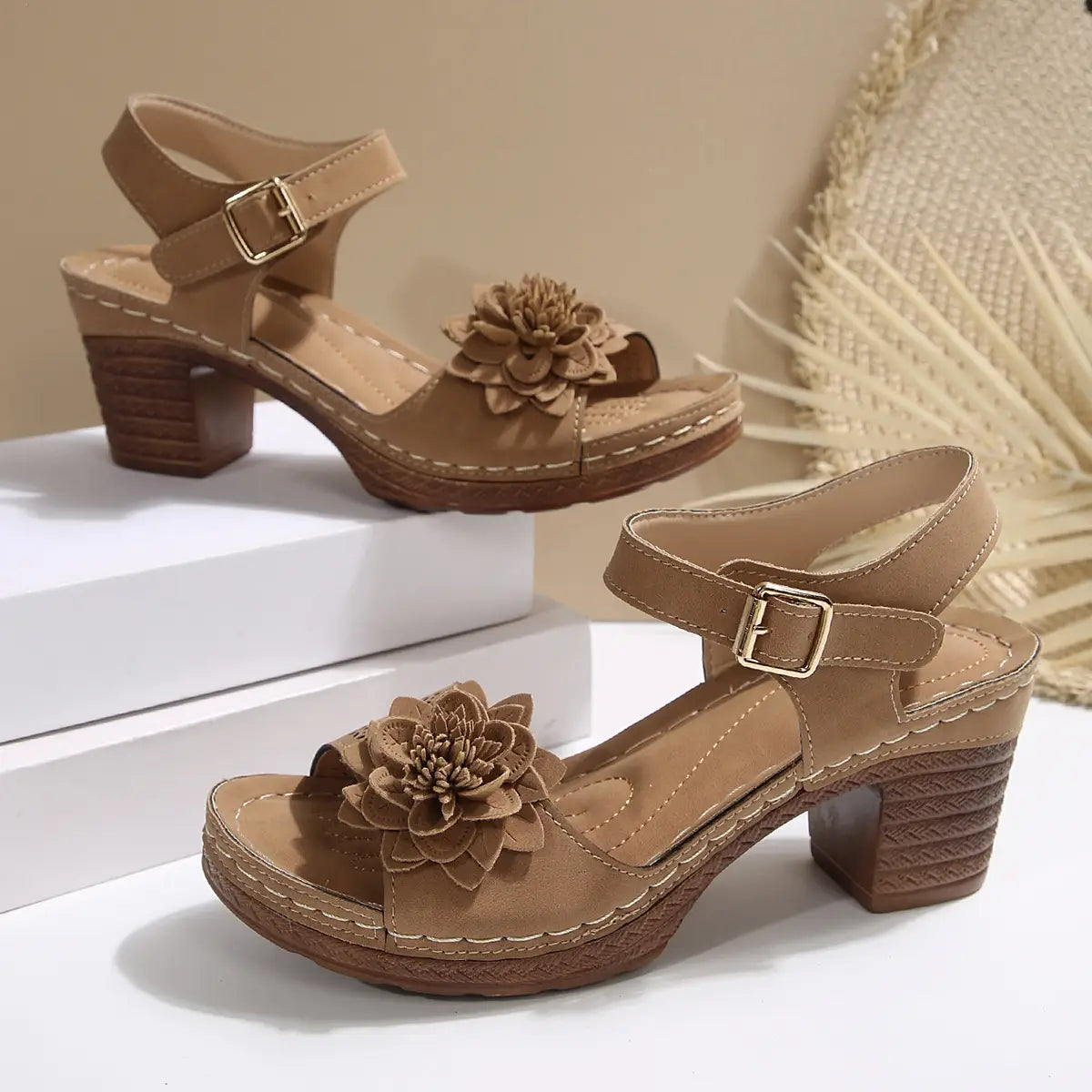 Beige suede chunky heel sandals with a textured block heel and a decorative fabric flower on the toe strap ideal for heel sandals summer.