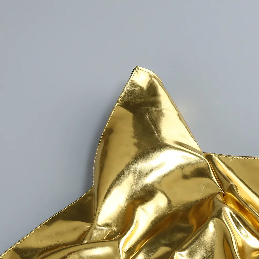 a shiny gold metallic fabric with a glossy reflective surface and visible stitching along the edge featured in a one-shoulder slit mop black dress two-piece set with set sexy lacing.