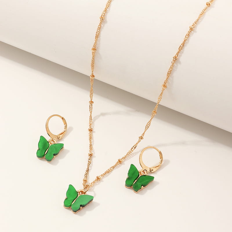 Fashion resin butterfly necklace and earring set featuring a gold chain with a green resin butterfly pendant and matching gold hoop earrings.
