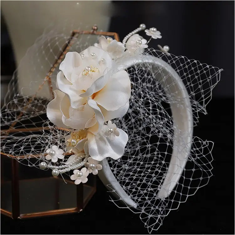 Elegant ivory pearl lace petal mesh hairband featuring delicate white floral lace, pearls, and satin petals.
