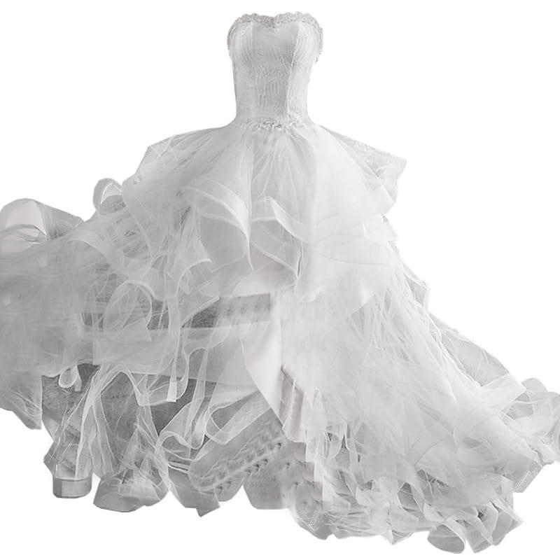 A voluminous white small trailing wedding dress featuring a sweetheart neckline, intricate lace bodice detailing, and a dramatic flowing skirt made of layered sheer tulle.