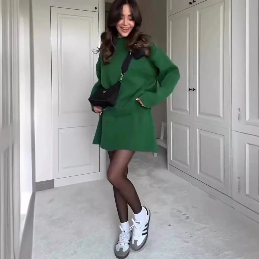 Green long sleeve knit dress with black collar featured in sweater skirt sets for casual pieces.