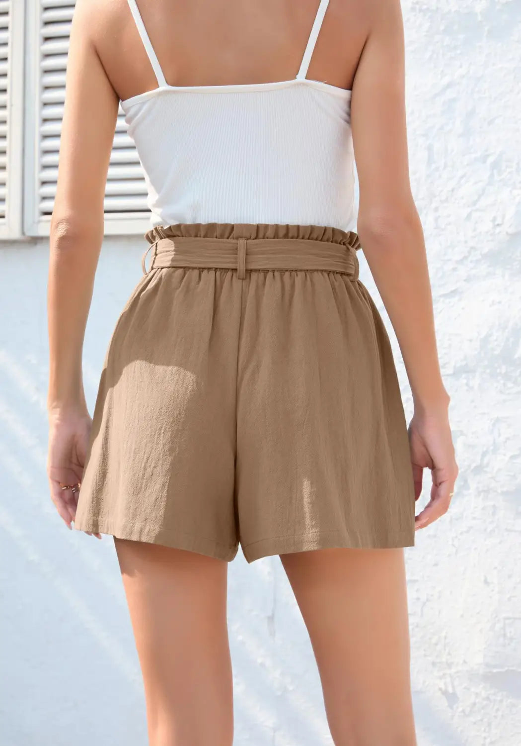 beige high-waisted shorts with a gathered waistband and matching belt featuring a fashion ruffle bow waist tie and pockets for a stylish and comfortable fit