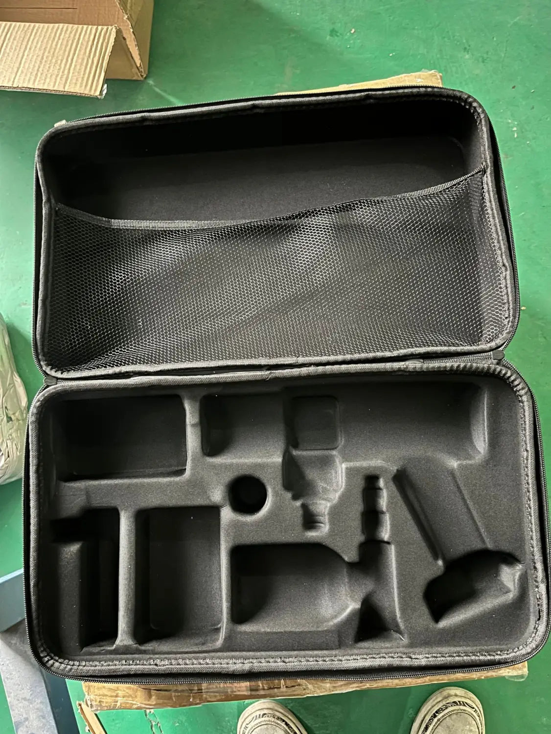 black foam-lined hard-shell carrying case with molded compartments for tools designed for multifunctional car wash high pressure water gun storage and organization