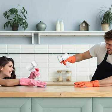 Man wearing orange gloves holding 1pc electric spin cleaning brush with white bristles for efficient electric spin cleaning tasks