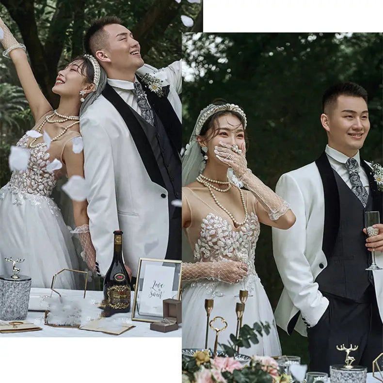 white lace wedding dress with beaded embellishments and a pearl necklace designed for a summer couple photo shoot