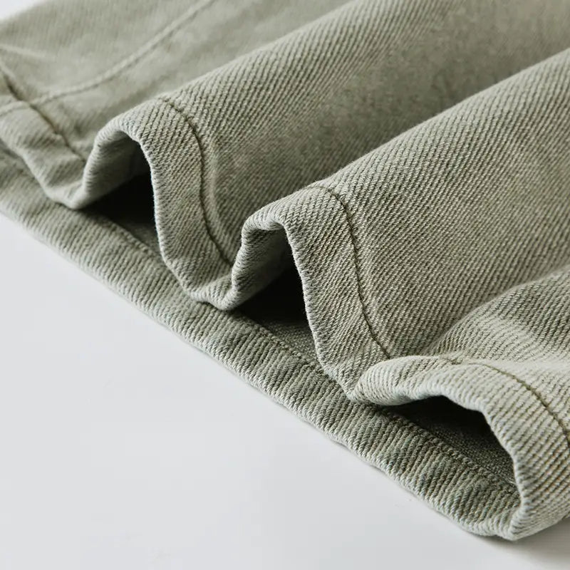 light green jeans double belt adjustable buckle shorts made of soft olive-green corduroy fabric with a subtle ribbed texture and neatly stitched seams
