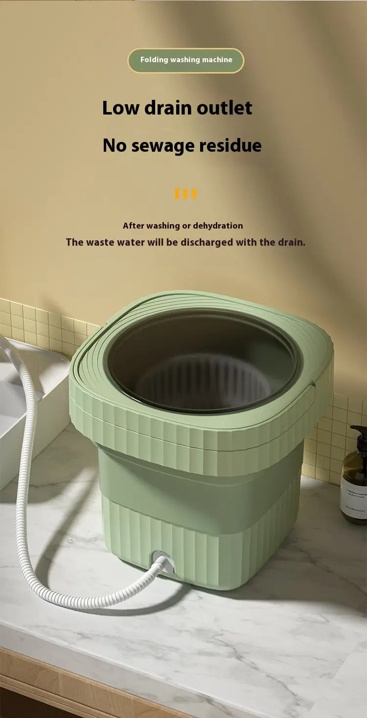 A compact mint green folding washing machine with a ribbed exterior and a transparent lid designed for convenient folding washing.