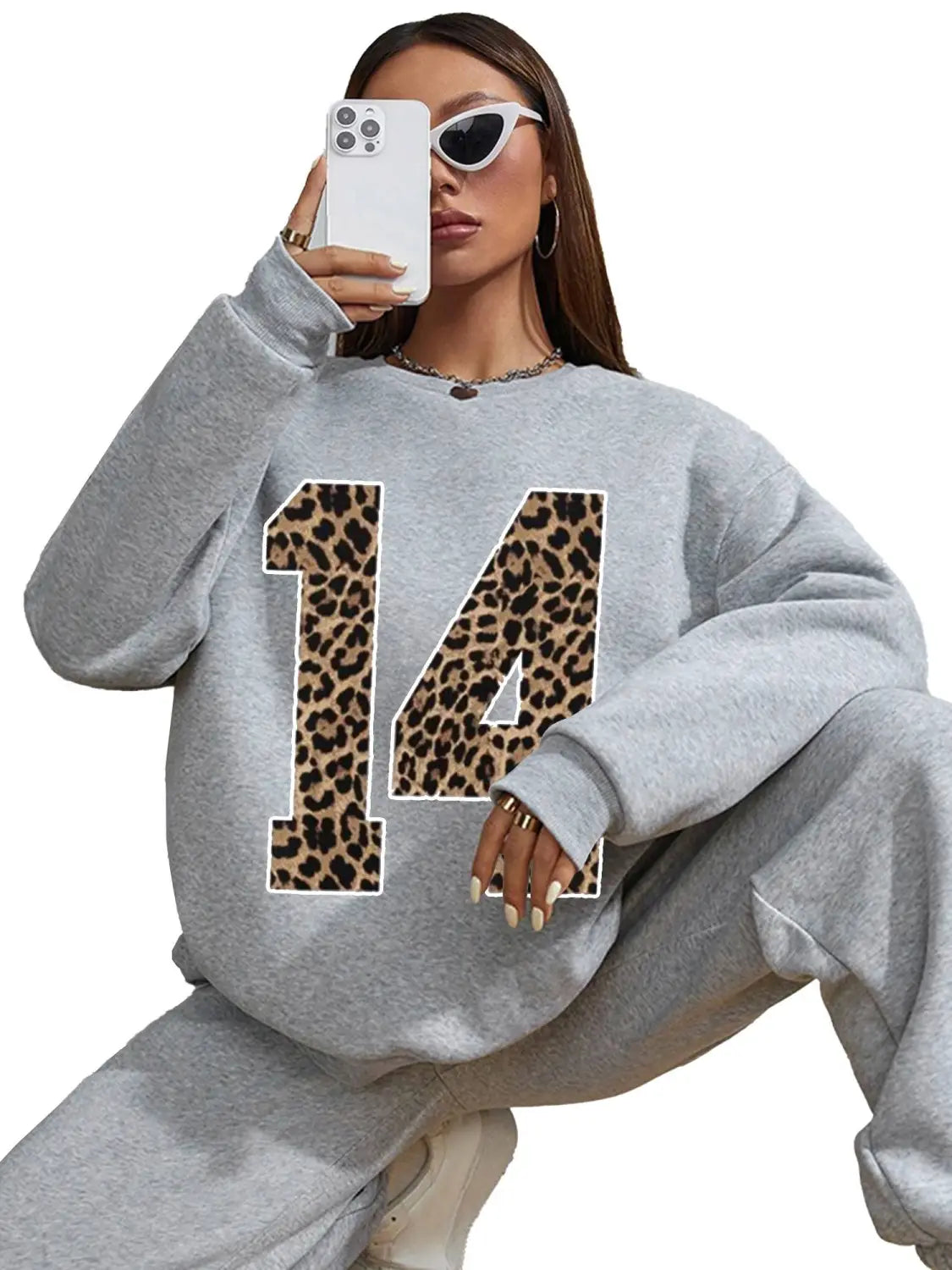 Gray crew neck sweatshirt featuring a bold black leopard print number 14 on the front.