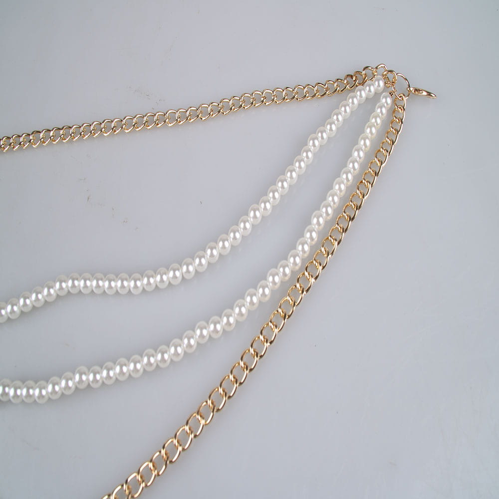 Gold-toned waist chain jewelry accessories featuring two strands of white pearls for elegant styling.