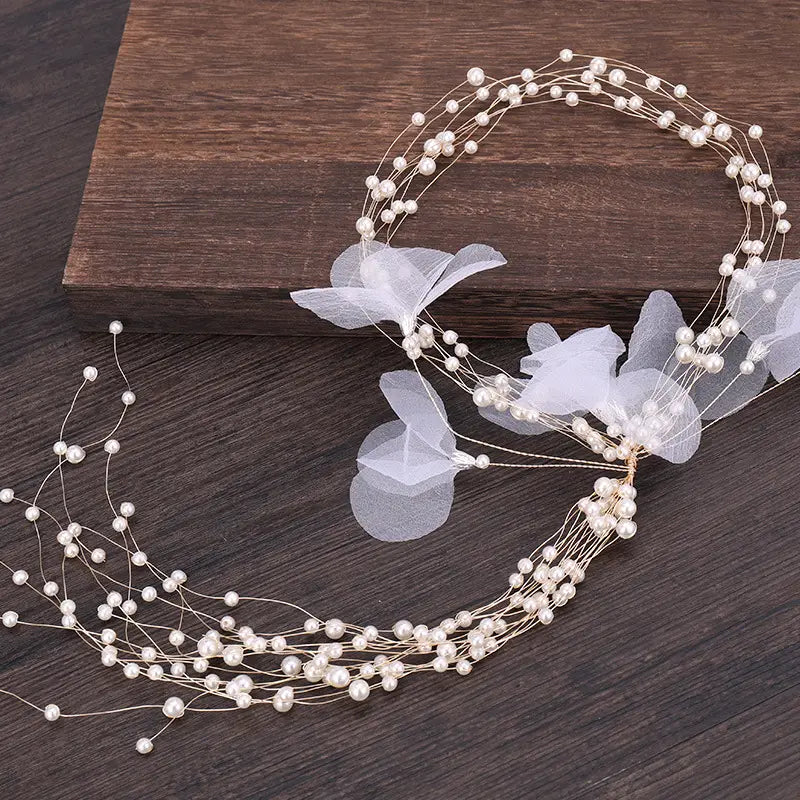 Elegant white pearl and organza flower bridal headdress handmade with delicate wire strands for a handmade pearl fairy look