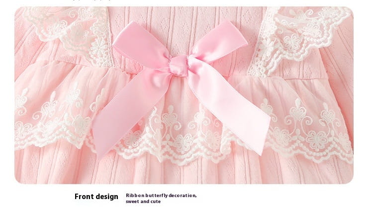 A delicate pink ribbon bow adorns the front of a soft pastel pink ribbed long sleeve newborn clothes jumpsuit with intricate white lace trim, ideal for autumn.