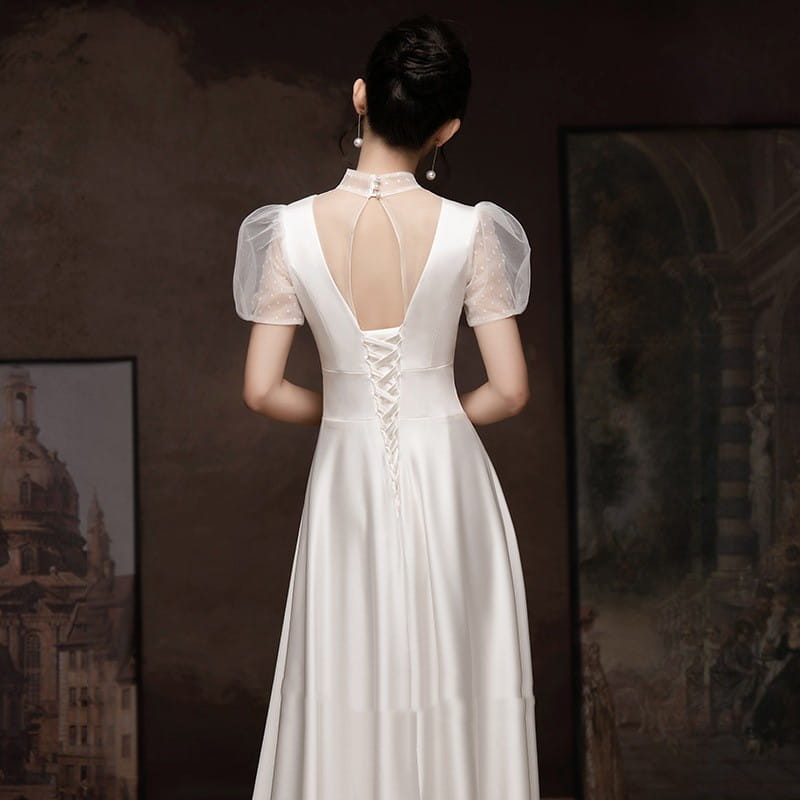 white satin puff sleeve engagement wedding dress showing the lace-up back and sheer puff sleeves of the white engagement wedding dress