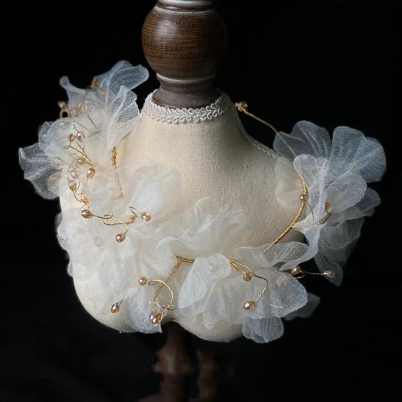 Elegant white lace choker adorned with delicate gold wire and pearl-like beads as part of a tulle flower headband earring set.