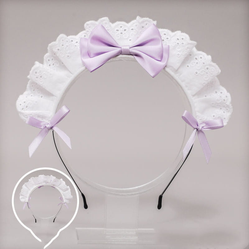a white lace bow maid headband featuring delicate lace and a central lavender satin bow with matching side bows