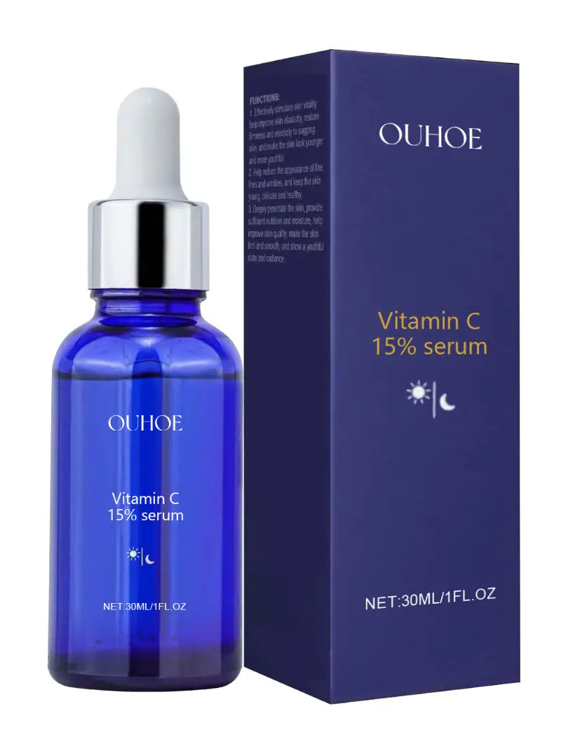 blue glass bottle with silver dropper cap and white pipette labeled ouhooe vitamin c 15 percent serum alongside matching dark blue packaging for anti aging tightening liquid.