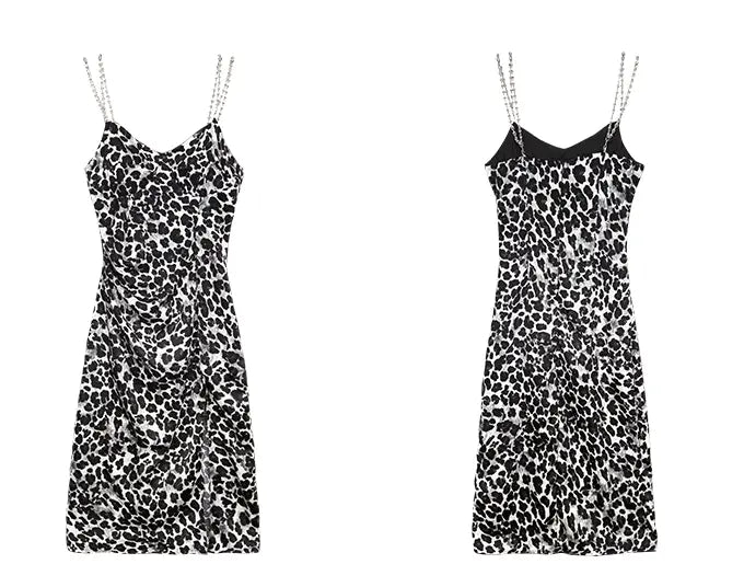 Black and white leopard print satin slip dress with chain straps showcasing a dark sexy leopard pattern in a sleek and elegant style.