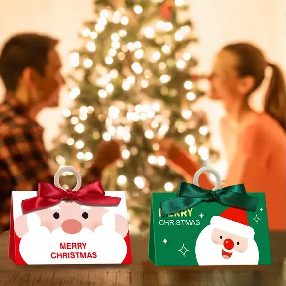 two festive christmas candy boxes featuring santa faces and merry christmas text, one red with a red bow and the other green with a matching green ribbon, part of a set of 10 santa claus christmas candy boxes with ribbon