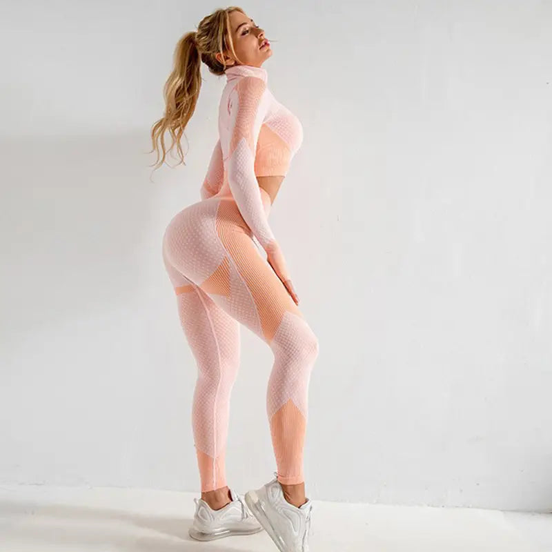 a two-piece athletic set in soft pink and peach mesh featuring a high-neck crop top and form-fitting leggings from the 3pcs yoga set seamless sport ribbed athleisure collection