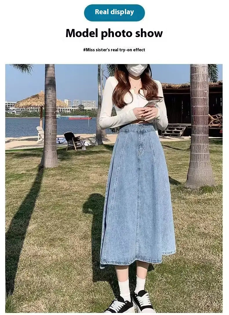 A light blue denim skirt women’s mid-length with a straight cut frayed hem made of high waist flared denim material.