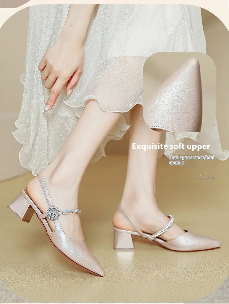 Shimmering champagne-colored satin pointed toe high heels with a chunky heel and jeweled ankle strap.