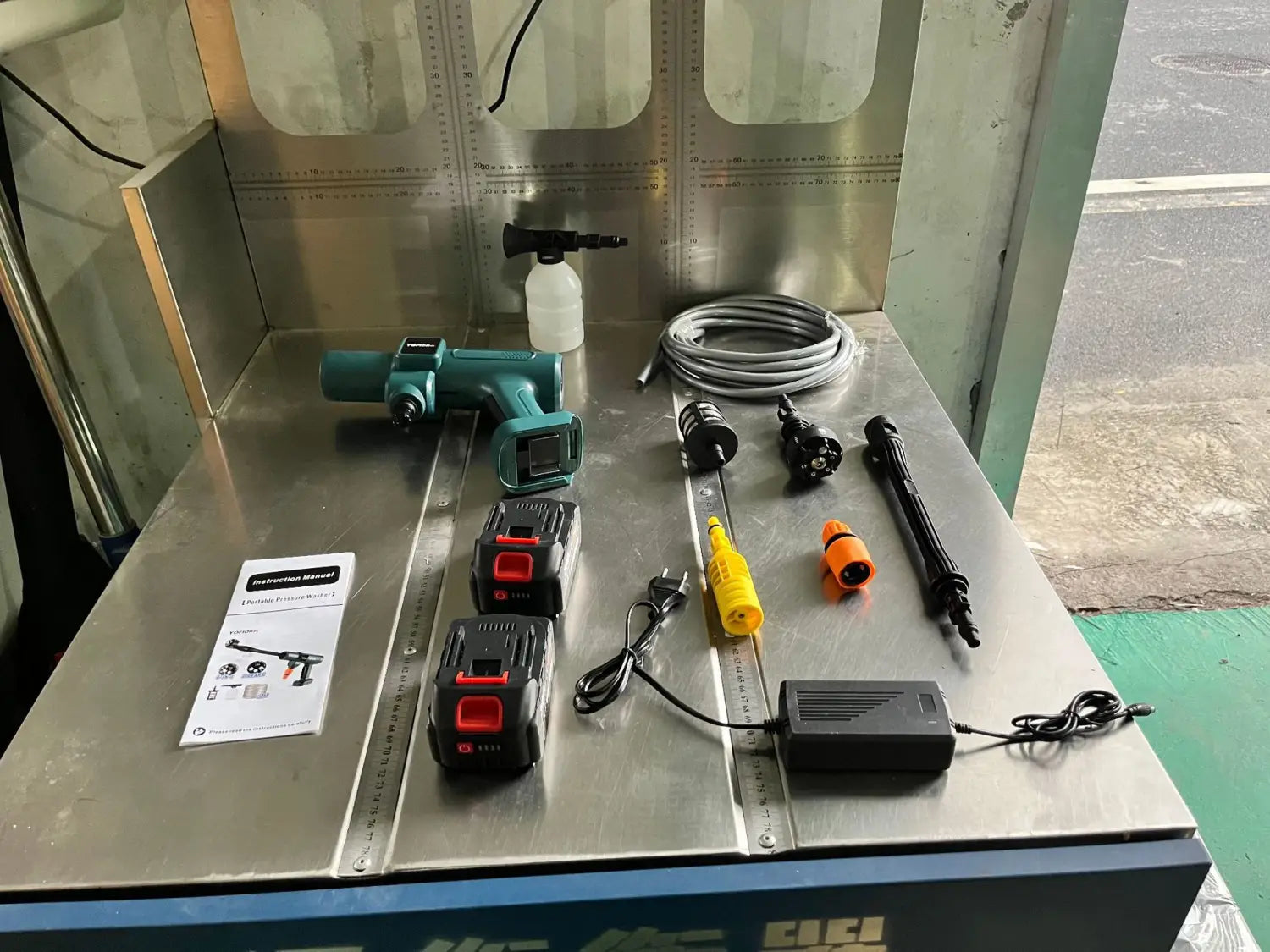 Multifunctional car wash high pressure water gun in teal with black accents and digital display for wash high pressure cleaning.