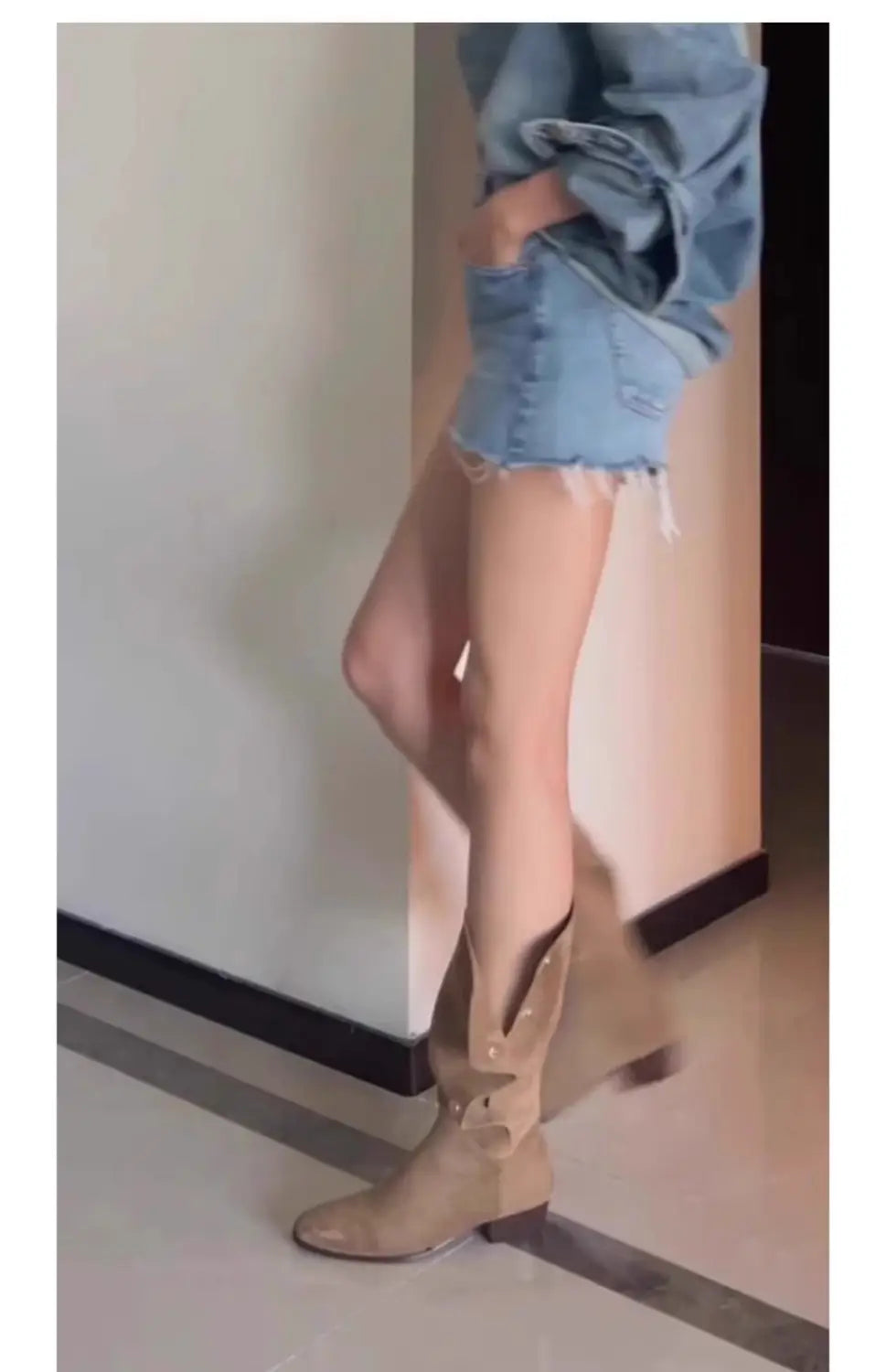 tan suede western cowboy pile style boots featuring low block heels and decorative silver-toned buckle accents