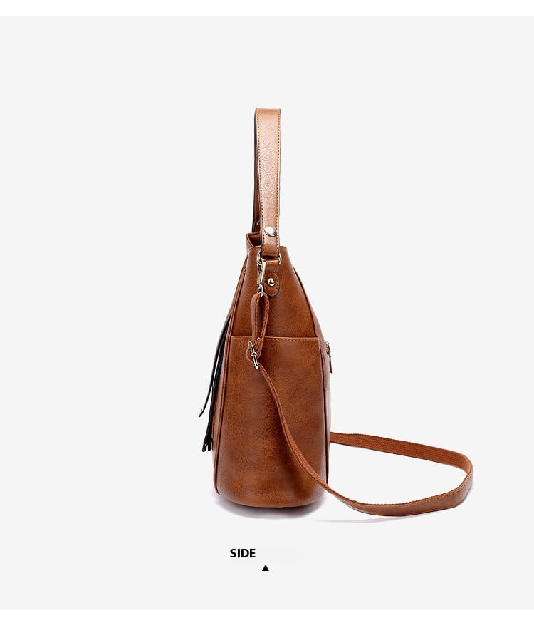 brown leather large capacity luxury women leather hobo bag with detachable shoulder strap and black tassel detail