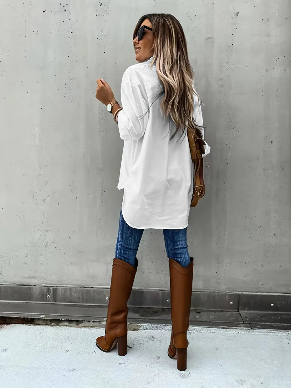 brown leather knee-high boots with block heels paired with a red loose long sleeve lapel button down shirt.