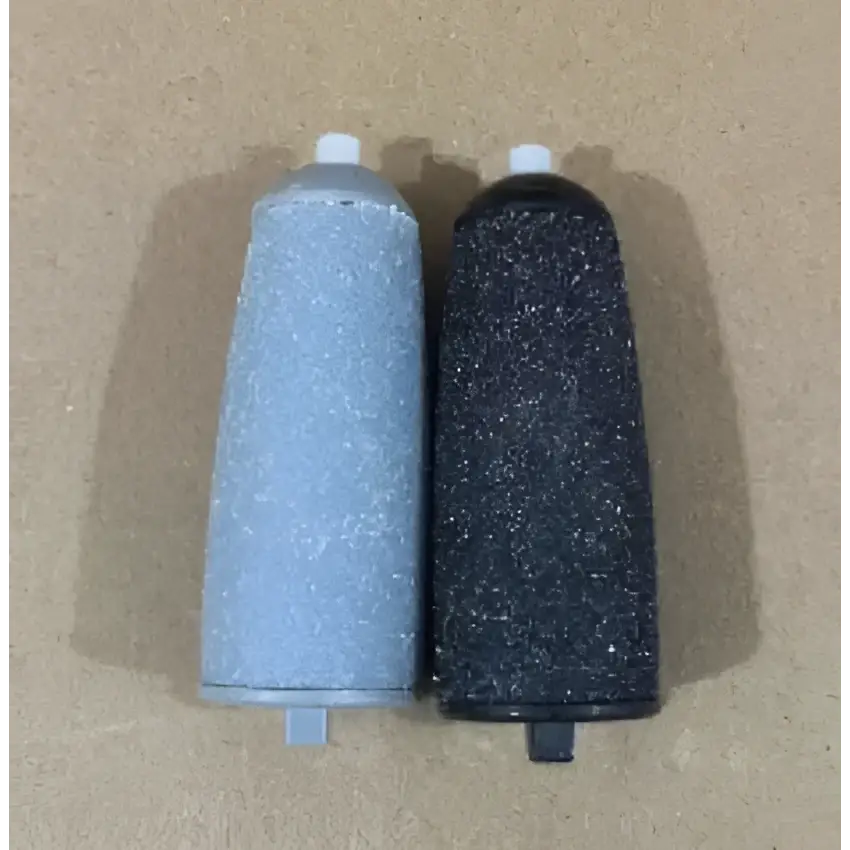 Electric foot grinder with textured light blue and black spray canisters featuring white caps and rechargeable battery